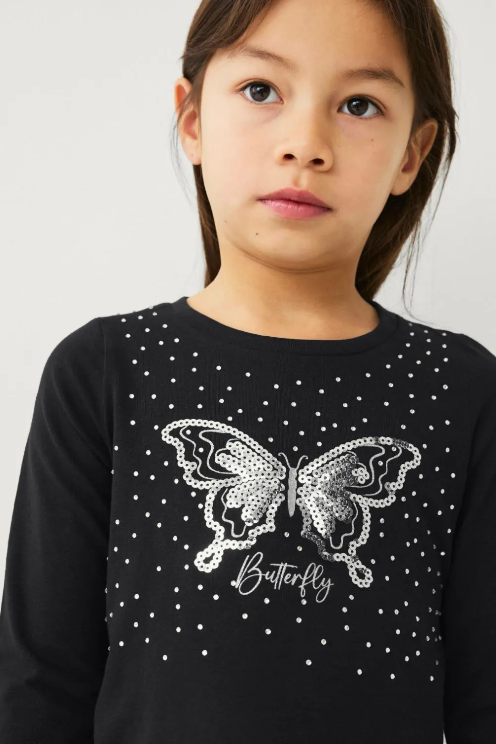 Ellos Toppe & T-Shirts>Collection Top Isla S Girl Sort med sølv print foran